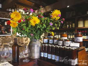 Beautiful flowers are placed on top the countertop, giving the cellar a more welcoming vibe.